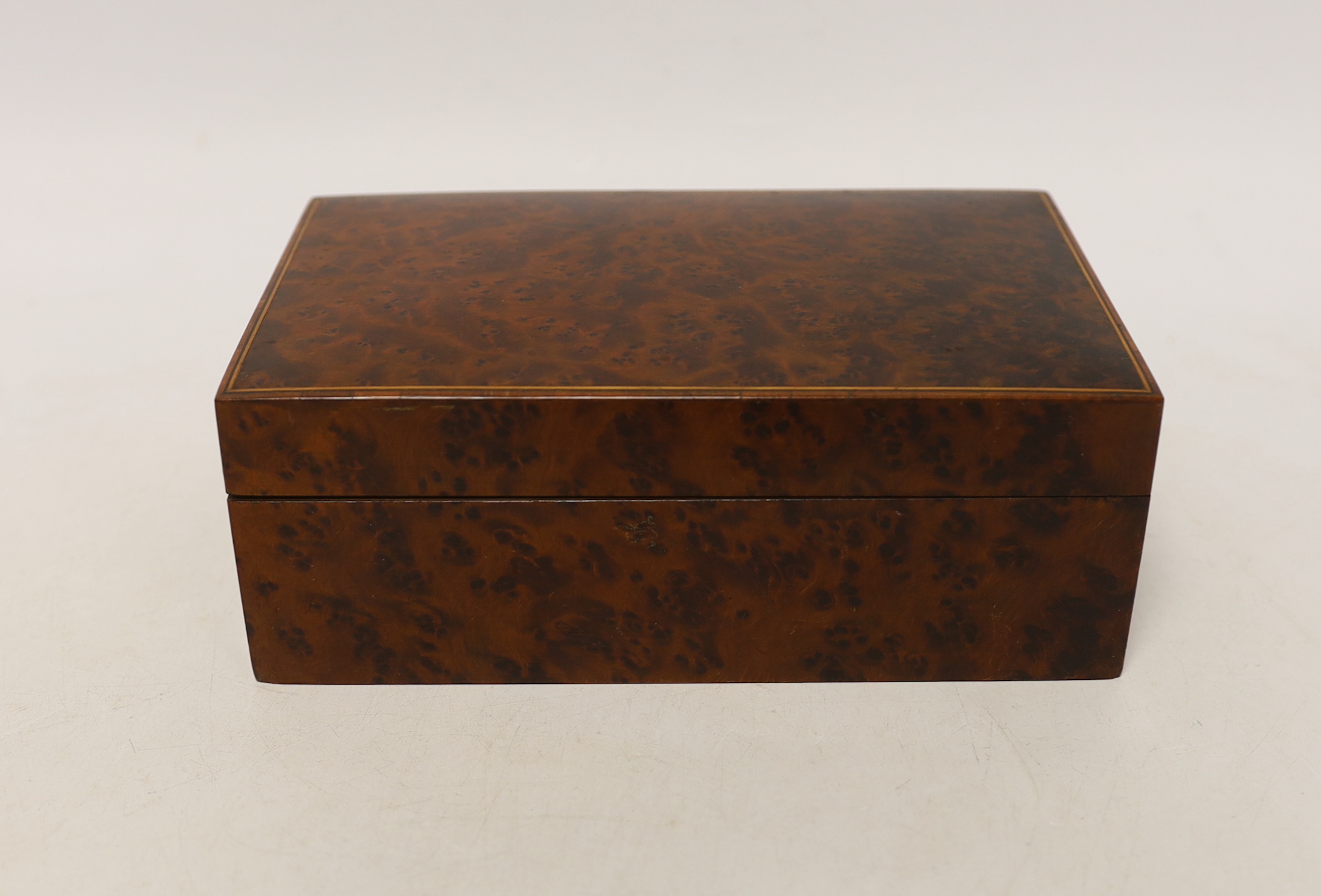 A 19th century Chinese carved boxwood box, an amboyna cigarette box and three others